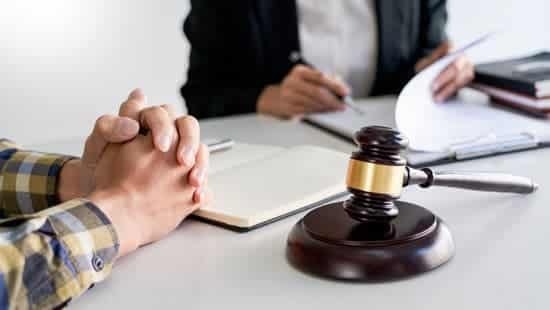 Lawyer Having Meeting And Consoling Solution To His Clients Prov