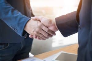 Two Confident Business Man Shaking Hands During A Meeting In The