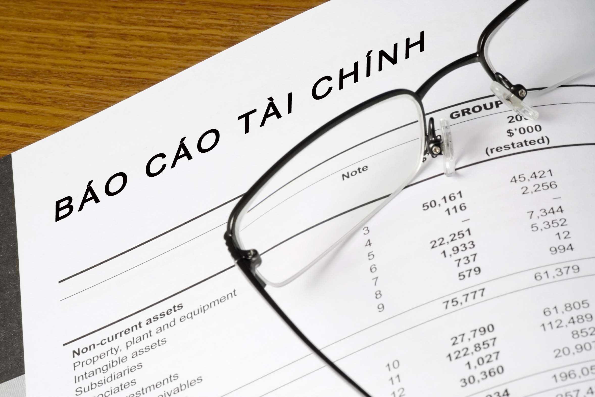 Balance Sheet Of A Financial Report With Spectacles