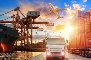 Logistics And Transportation Of Container Cargo Ship And Cargo Plane With Working Crane Bridge In Shipyard