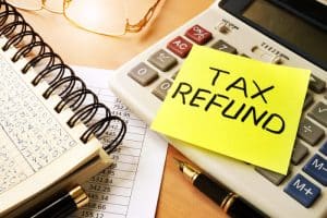 Memo Stick With Words Tax Refund. Business Concept.