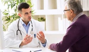 Doctor Talking With Old Patient