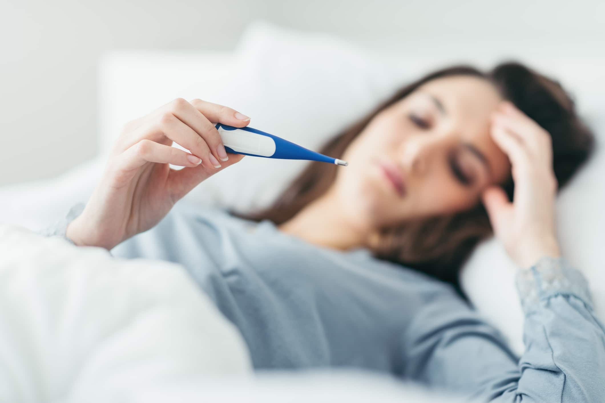 Woman Measuring Her Temperature