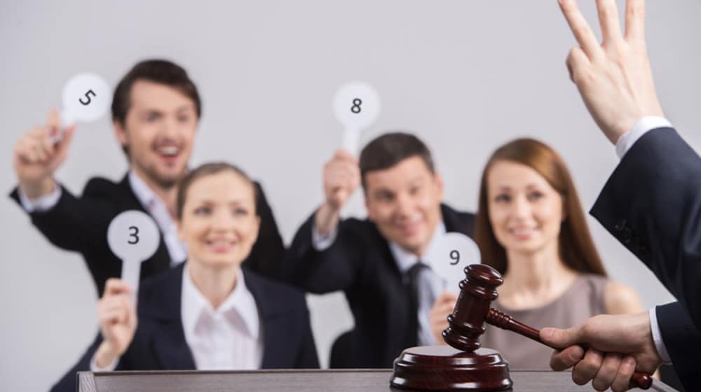 Four People Raising Cards With Number. Judge Counting And Holdin